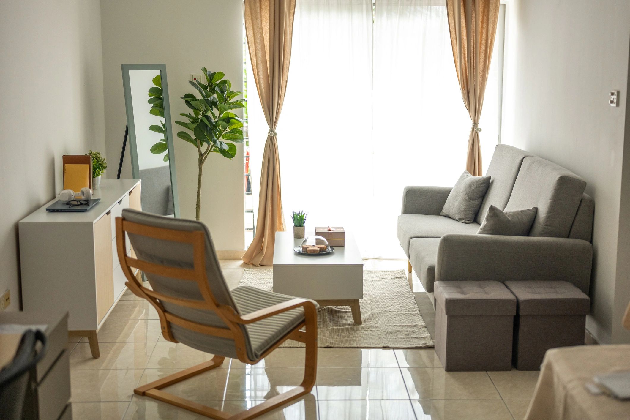 Modern living room with a grey sofa and armchair