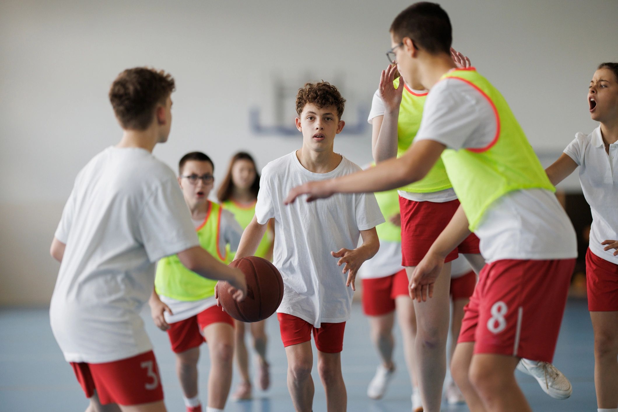 Basketball players in action on court