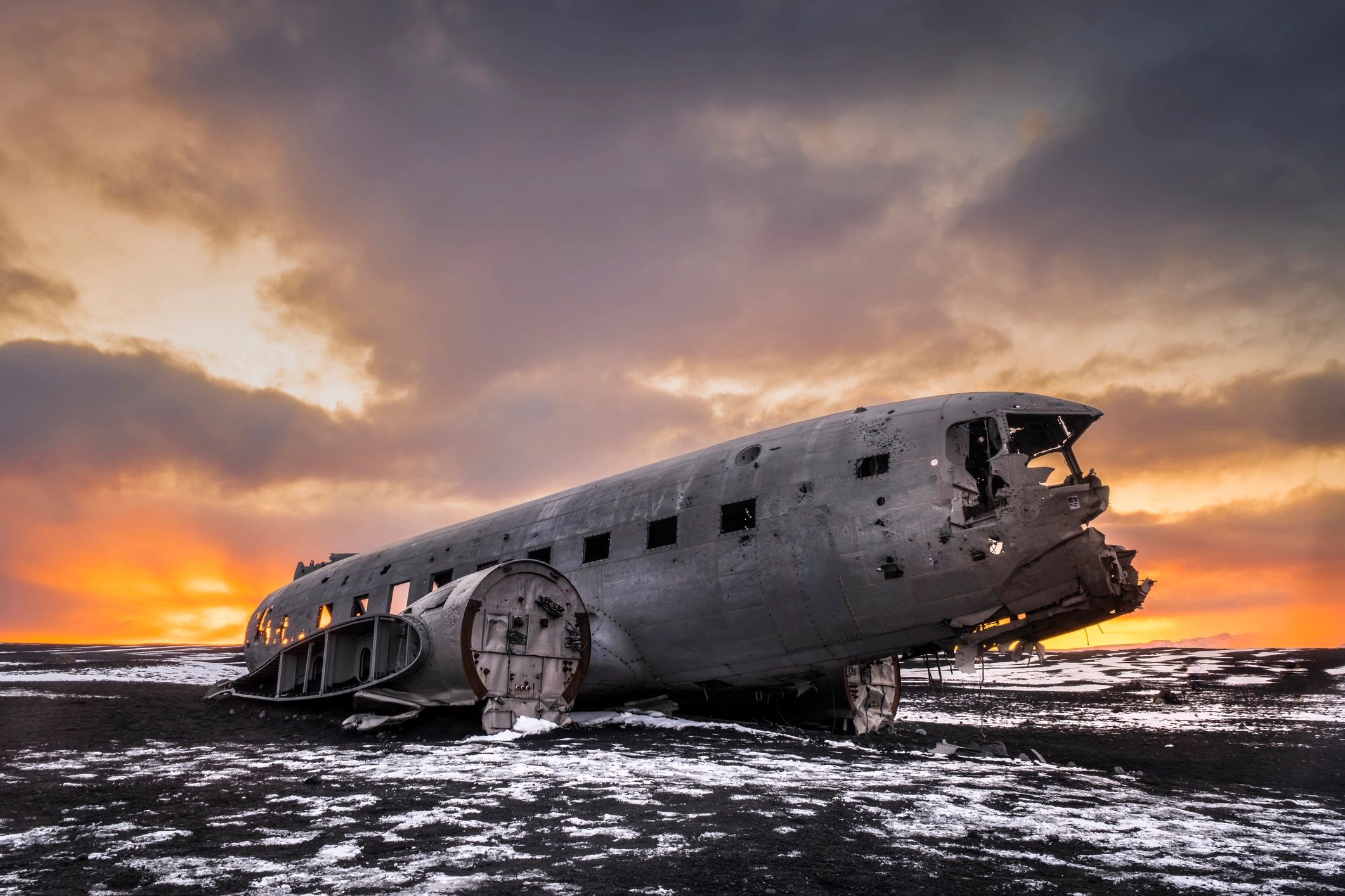 Plane wreckage on a black sand beach in Iceland