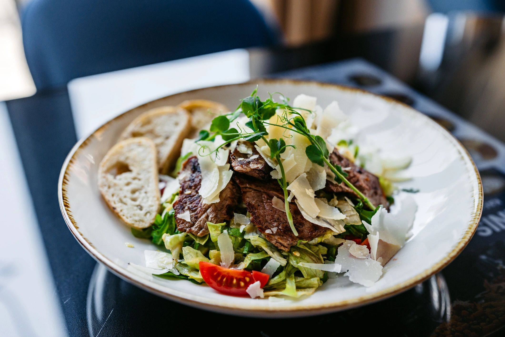 Beefsteak salad served on a table