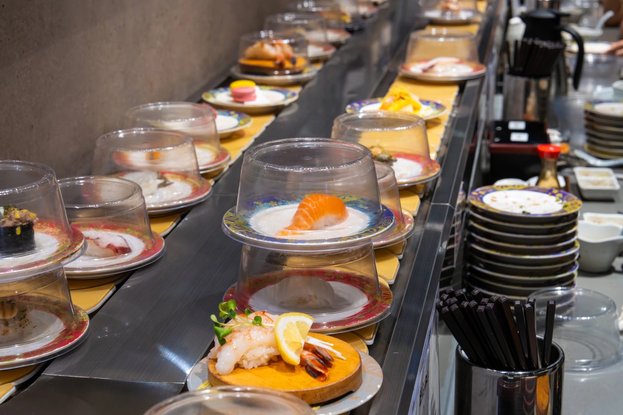 Fresh sushi plates on a restaurant conveyor belt