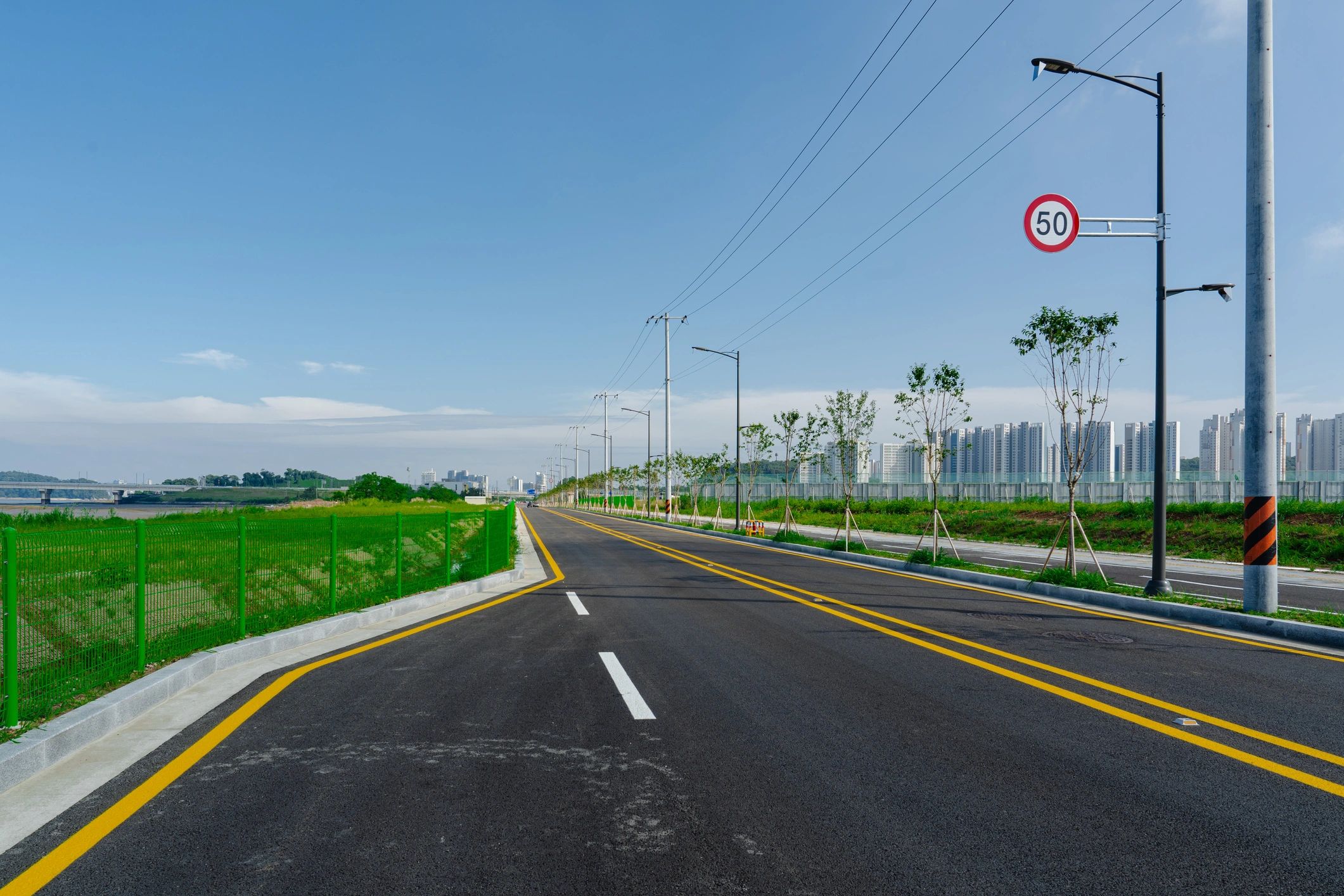 Open road leading toward a distant city skyline